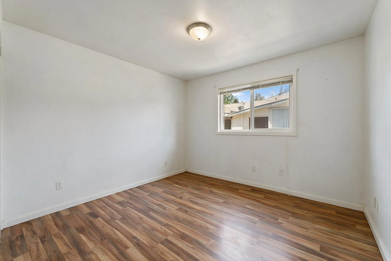 Virtual renovation before and after: upgrading a builder-grade living room with layered finishes and staging (before photo)